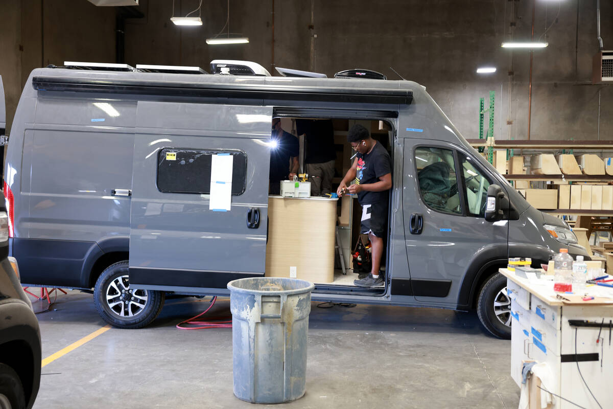 Workers convert a van into a mobile home at Noovo manufacturing facility in Las Vegas Thursday, ...