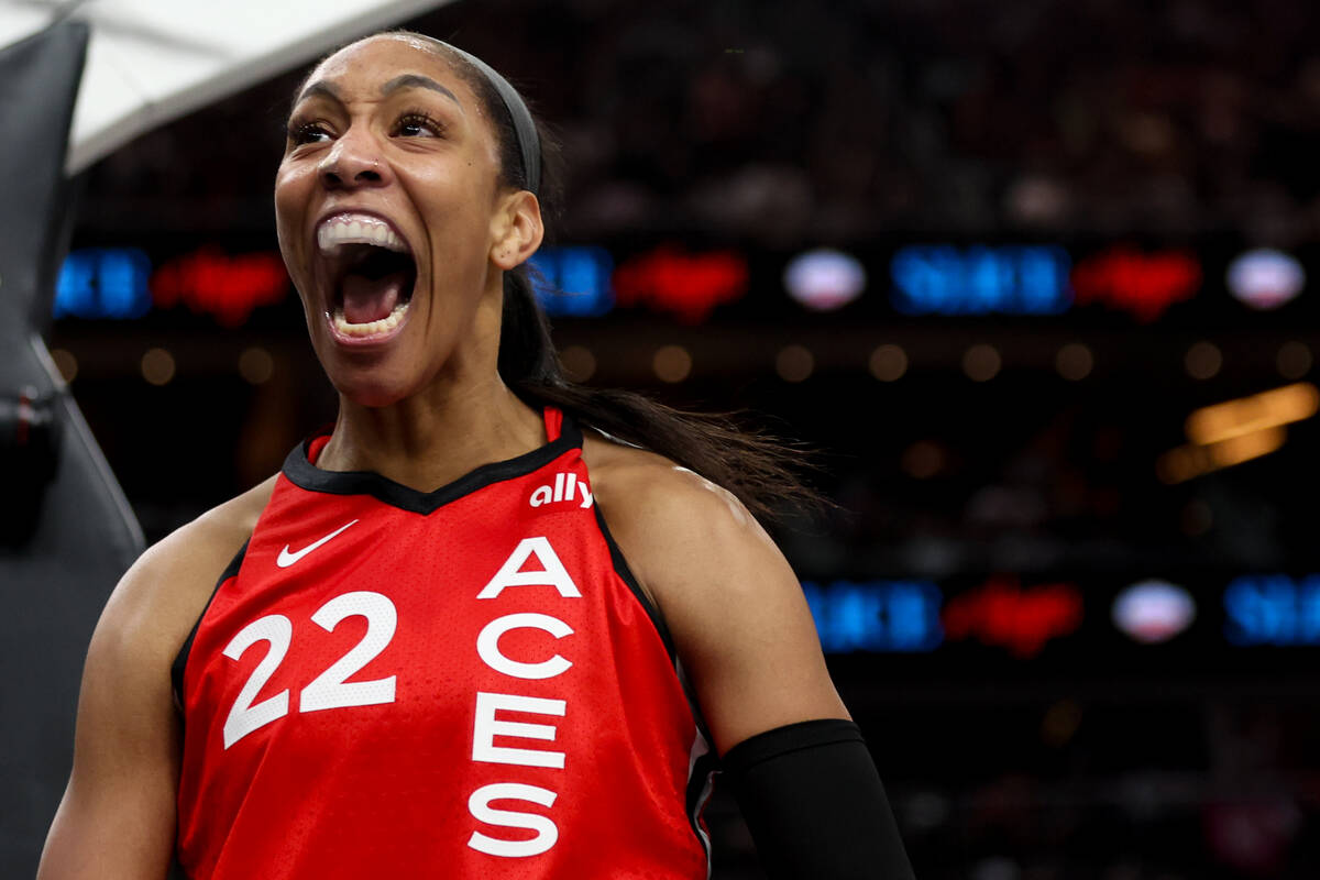 Las Vegas Aces center A'ja Wilson celebrates after scoring and drawing a foul during the first ...