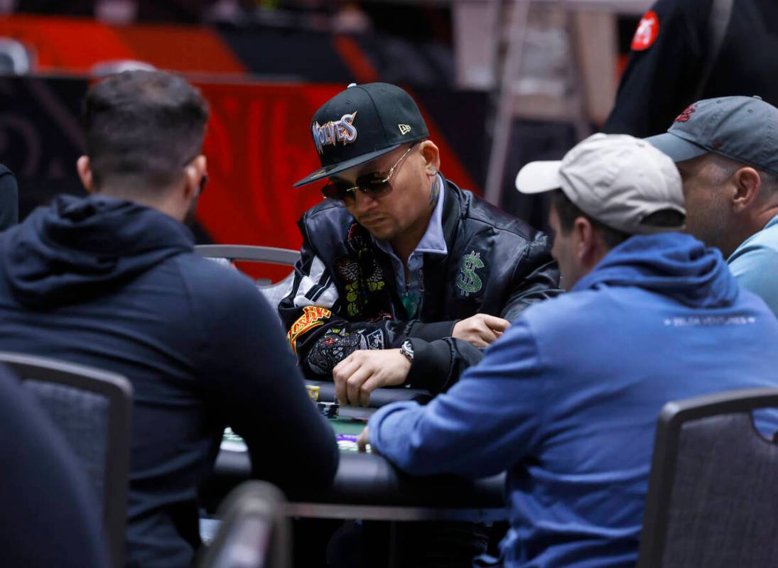 The 2016 WSOP Main Event Winner Qui Nguyen, center, and the 2012 winner Greg Merson, left, part ...