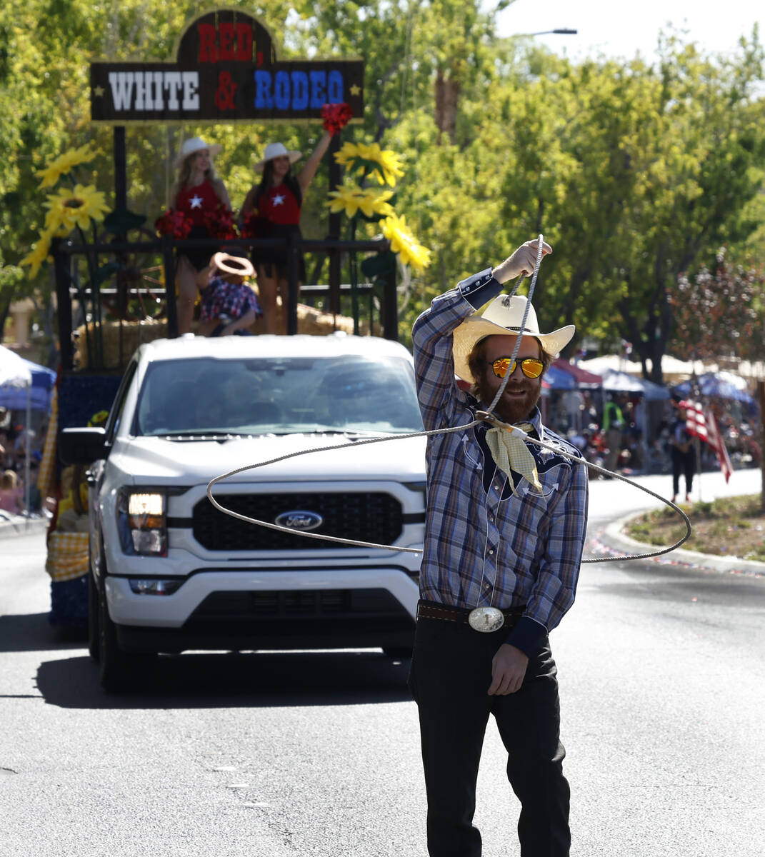 Kyle Peterson, a cowboy trick roper, performs during the annual Summerlin Council Patriotic Par ...