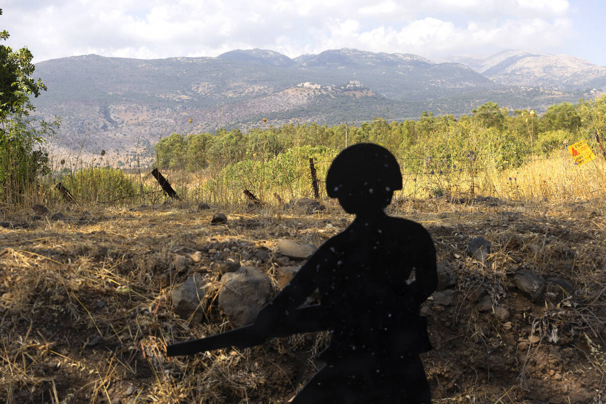 A soldier shaped target lays near the border with Lebanon as seen from a position on the Israe ...