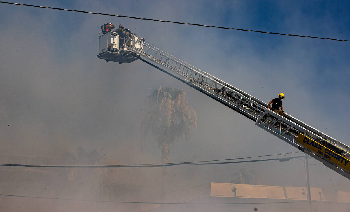 Clark County firefighters work to contain an apartment fire on Dumont Boulevard on Wednesday, J ...