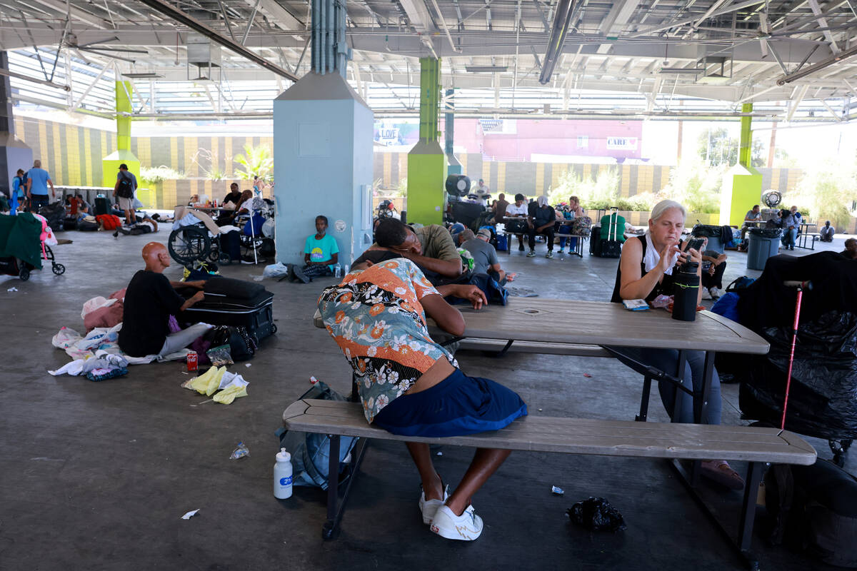 People beat the heat with misters and shade at the Courtyard Homeless Resource Center in Las Ve ...
