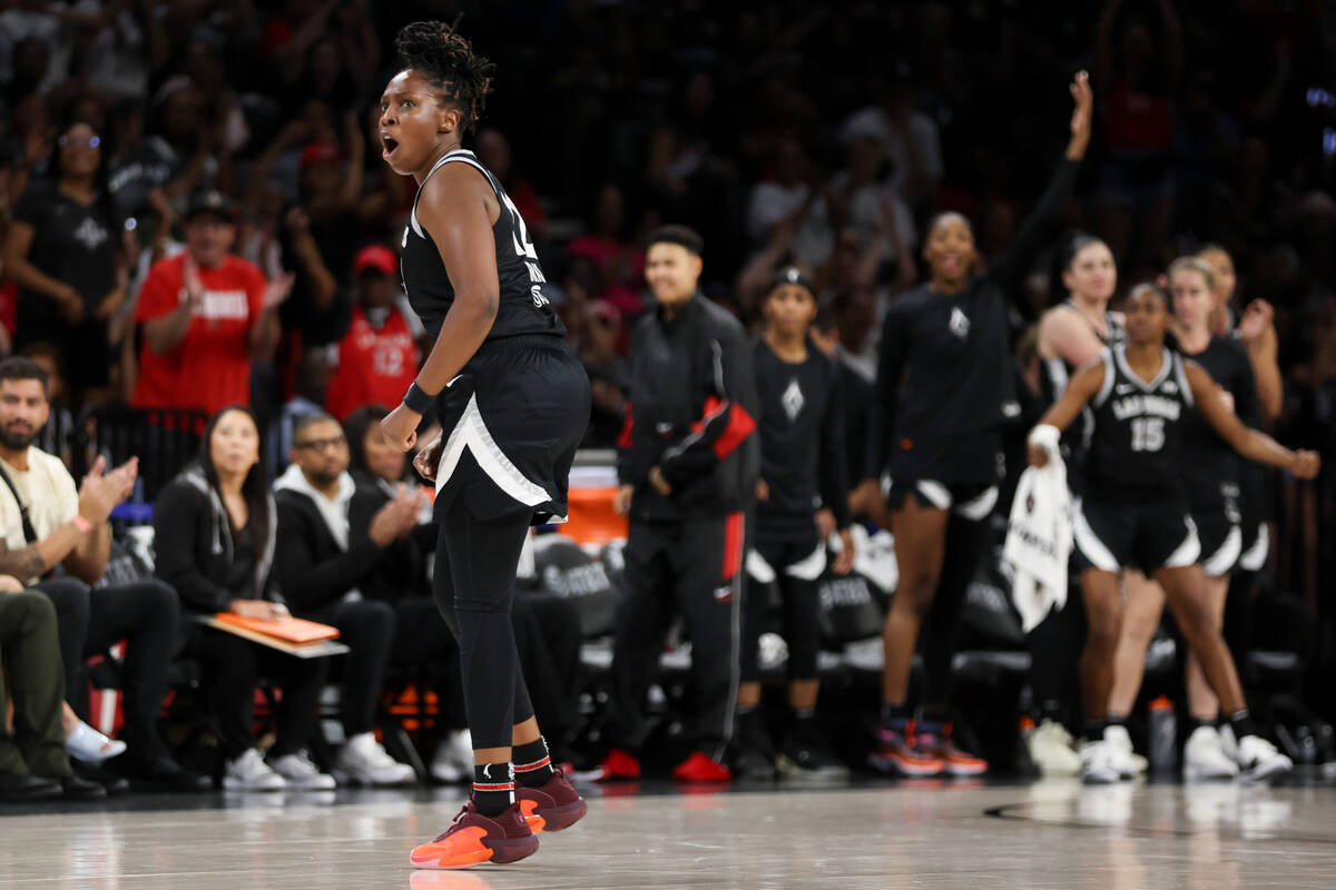 Las Vegas Aces guard Chelsea Gray (12) celebrates a score during the second half of a WNBA bask ...