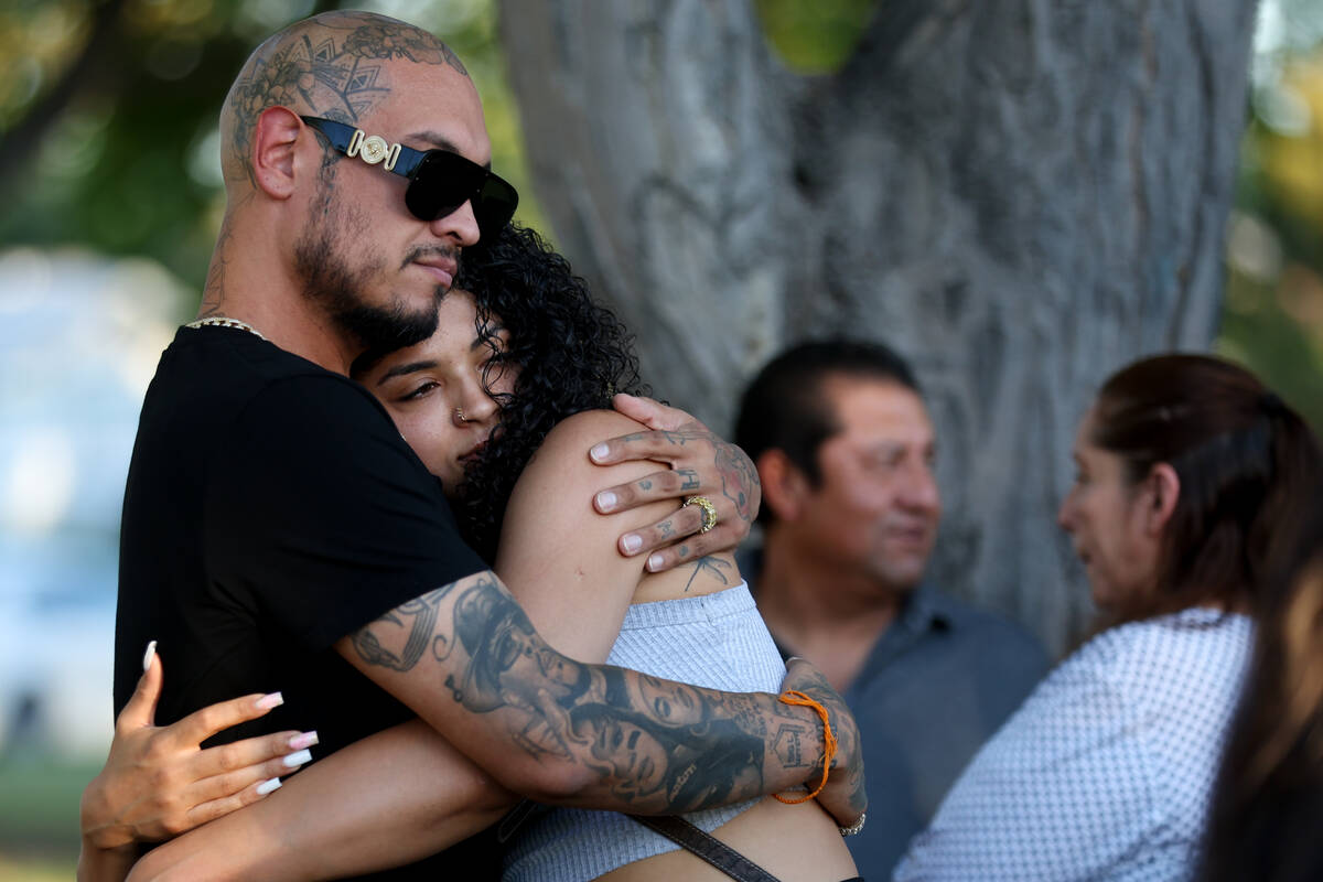 Loved ones of Alondra Rivera embrace during a vigil at Winterwood Park on Wednesday, July 3, 20 ...
