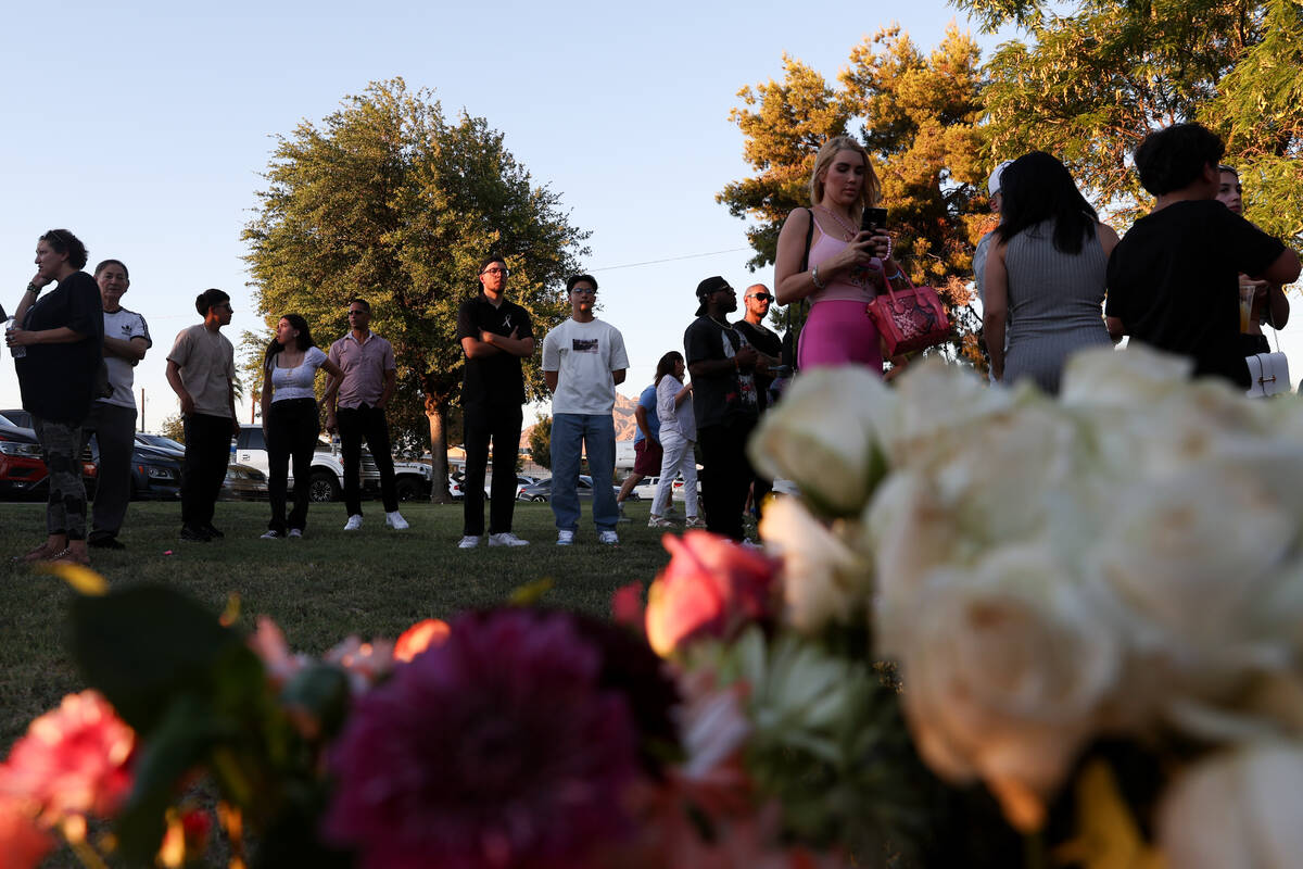 Alondra Rivera’s friends and family gather for a vigil at Winterwood Park on Wednesday, ...