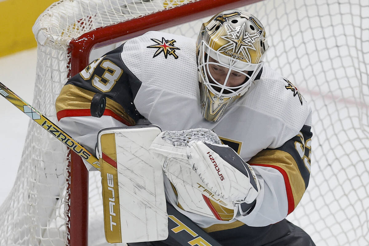 Vegas Golden Knights goaltender Adin Hill (33) blocks a shot in Game 7 of an NHL hockey Stanley ...