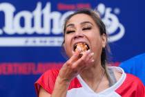 Miki Sudo competes in the women's division of Nathan's Famous Fourth of July hot dog eating con ...