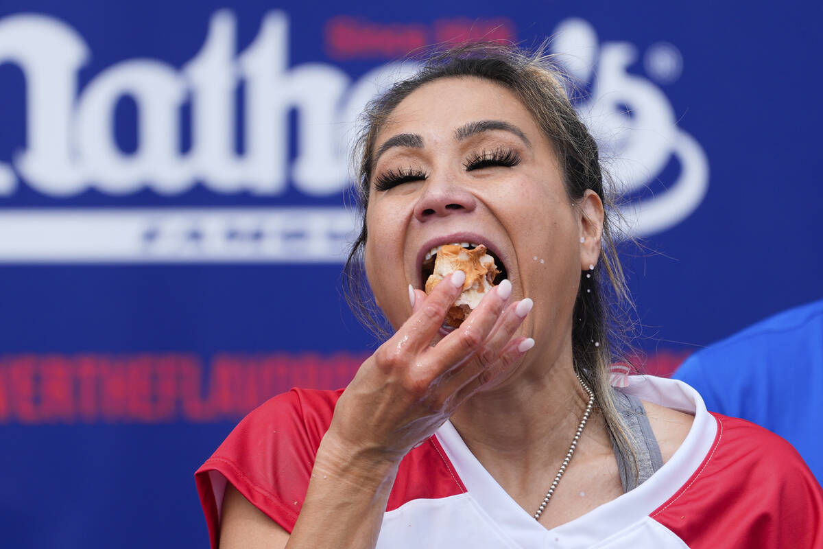 Miki Sudo competes in the women's division of Nathan's Famous Fourth of July hot dog eating con ...