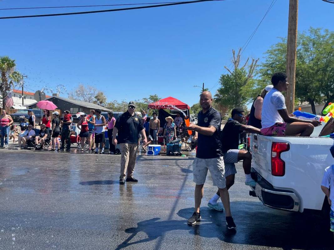 Attorney General Aaron Ford fires his water gun at Boulder City's Damboree celebration on July ...