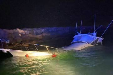 This photo shows a power boat that crashed into a jetty in Southern California on Wednesday, Ju ...