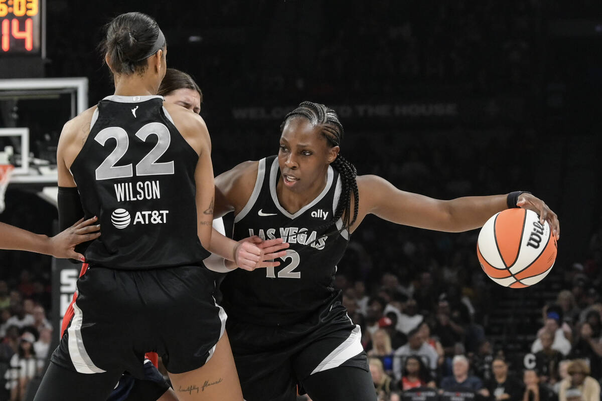 Las Vegas Aces center A'ja Wilson (22) sets a pick for Las Vegas Aces guard Chelsea Gray (12) d ...