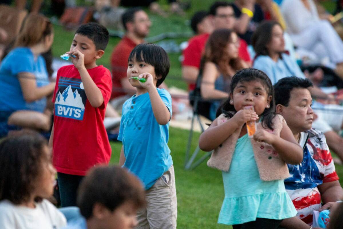 Children eat popsicles during the Independence Day celebration at Lake Las Vegas Thursday, July ...