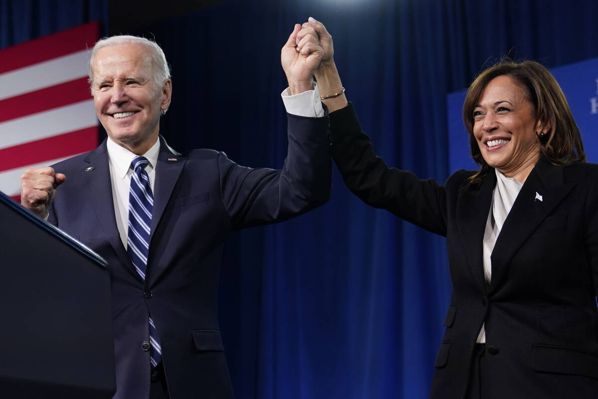 President Joe Biden and Vice President Kamala Harris stand on stage at the Democratic National ...