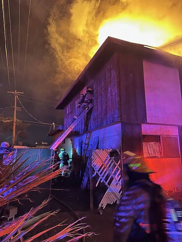 Clark County firefighters battle a fire in the 4900 block of Lana Drive believed to have been c ...