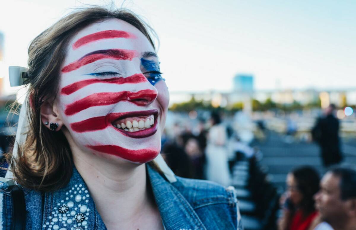 Michelle Harrington, 18, giggles with a face full of face paint for the Fourth of July at the S ...