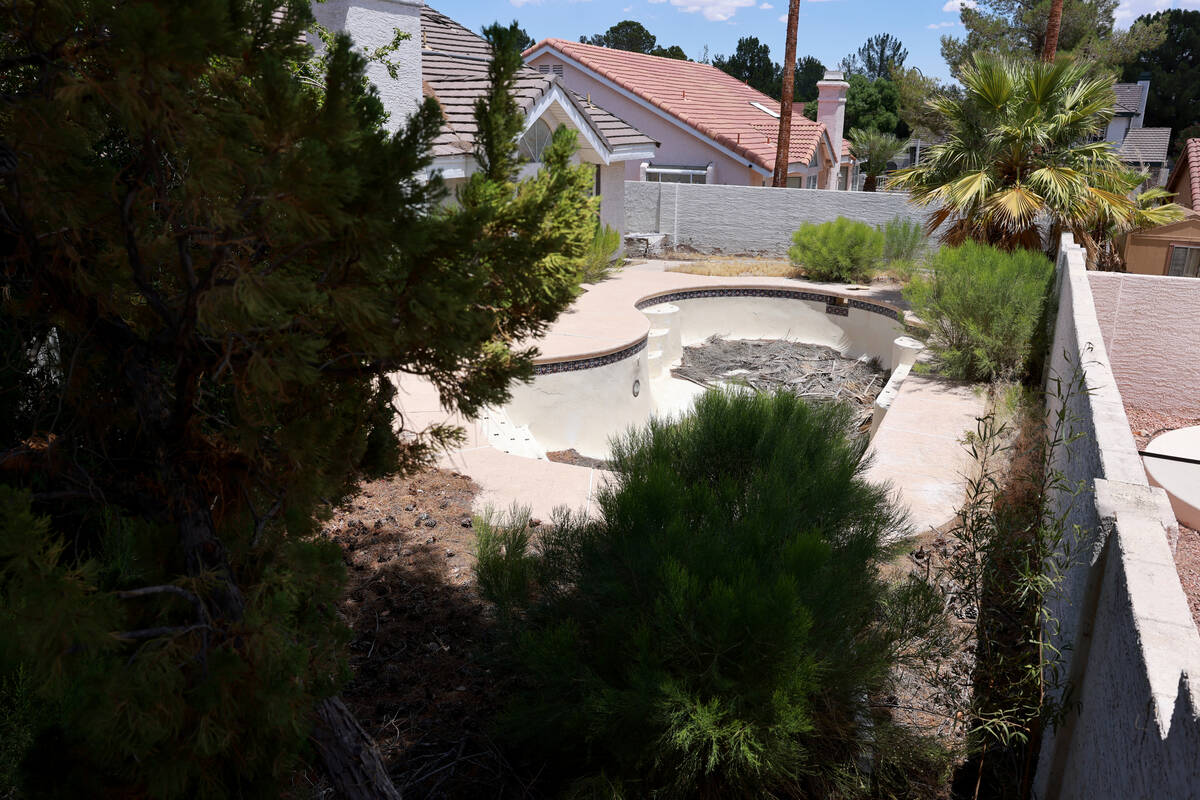 The backyard of a vacant house is shown at The Lakes Monday, June 24, 2024, in Las Vegas. Neigh ...