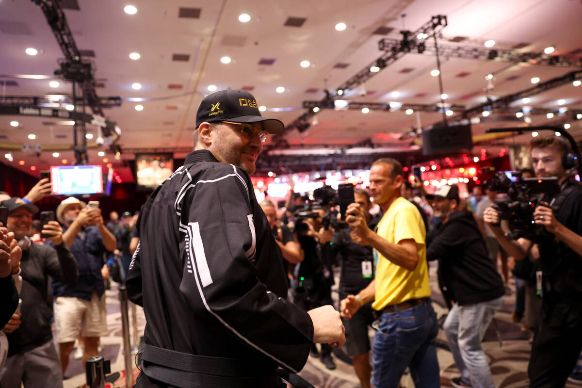 Professional poker player Phil Hellmuth makes a grand entrance to the song “Kung Fu Figh ...