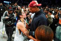 Las Vegas Aces' Kelsey Plum, left, talks with New York Giants Darren Waller after Game 4 of a W ...
