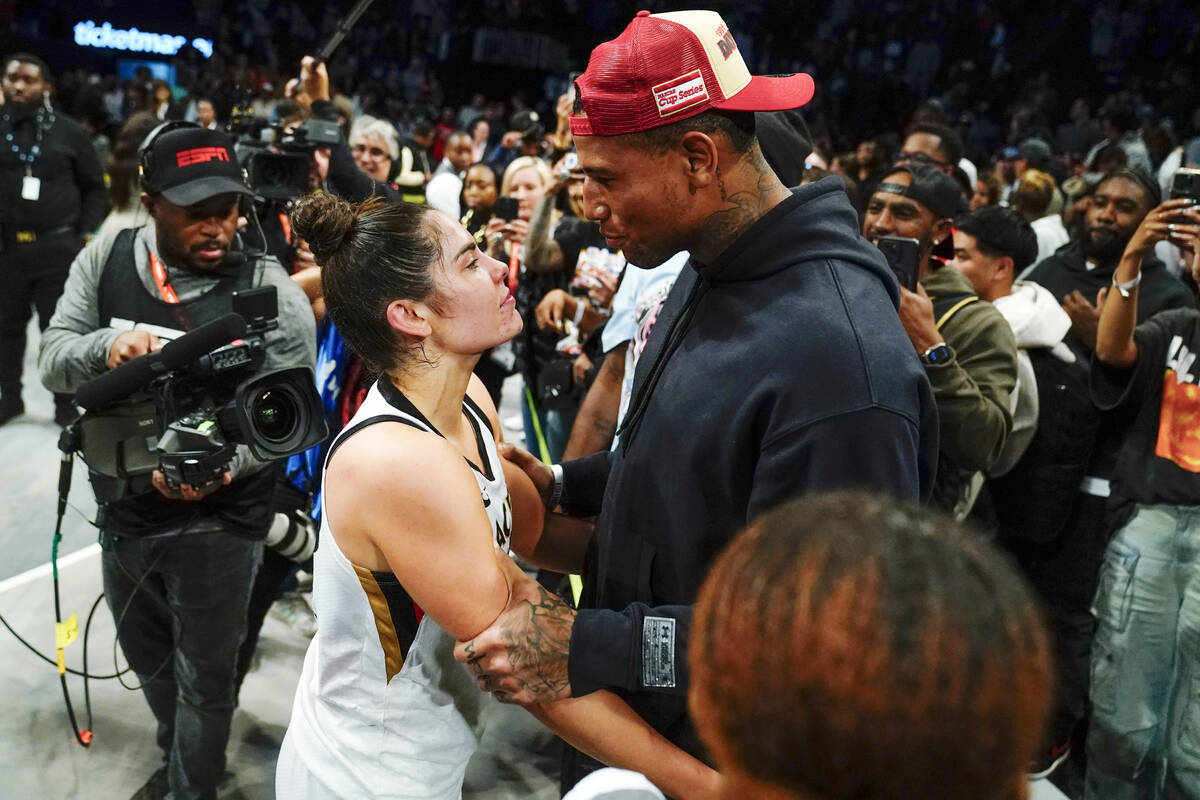 Las Vegas Aces' Kelsey Plum, left, talks with New York Giants Darren Waller after Game 4 of a W ...