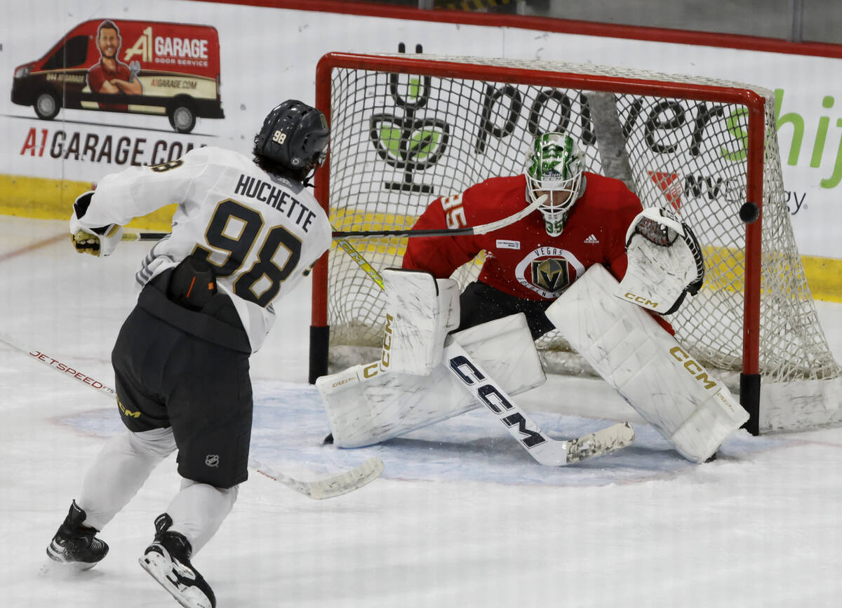 Golden Knights goaltender Carl Lindbom (35) blocks the puck shot by forward Mikael Huchette (98 ...