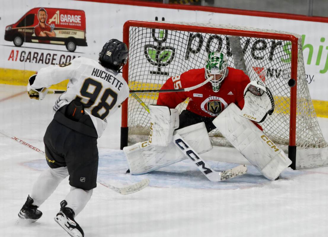 Golden Knights goaltender Carl Lindbom (35) blocks the puck shot by forward Mikael Huchette (98 ...