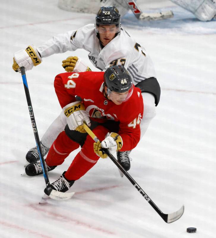 Golden Knights forward Will Dineen (73) chases defenseman Christoffer Sedoff (44) during team's ...