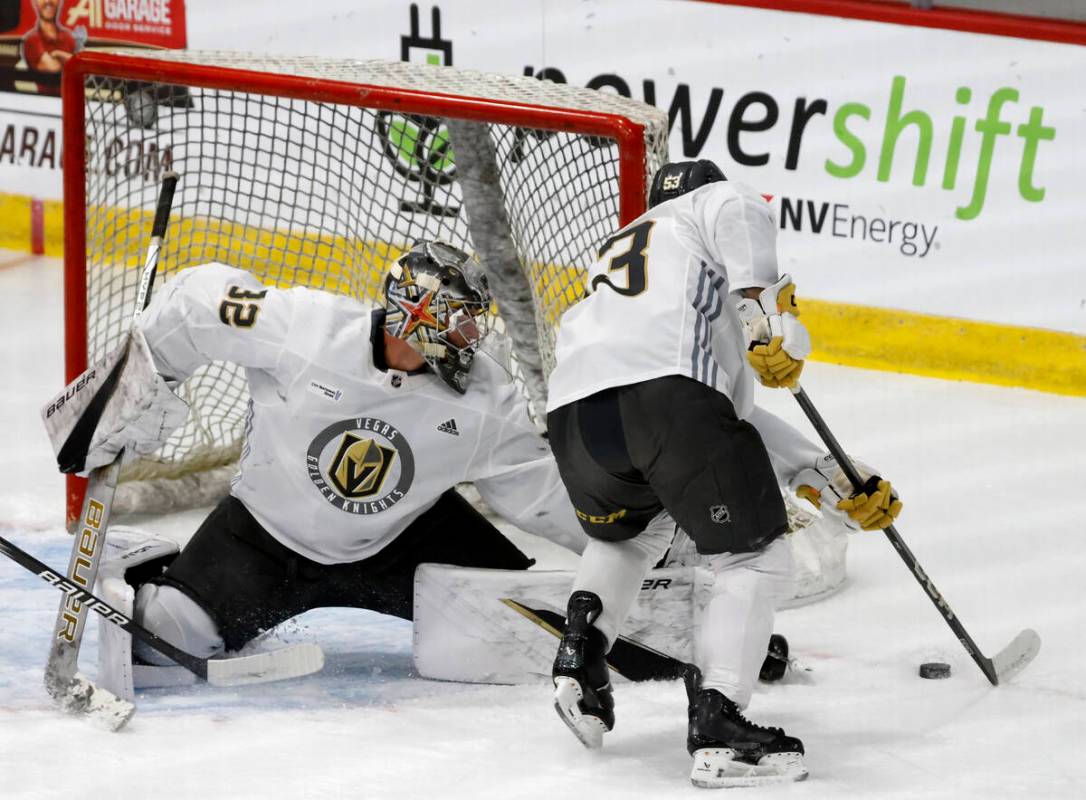 Golden Knights goaltender Jesper Vikman (32) stretches to block forward Simon Pinard's (53) puc ...