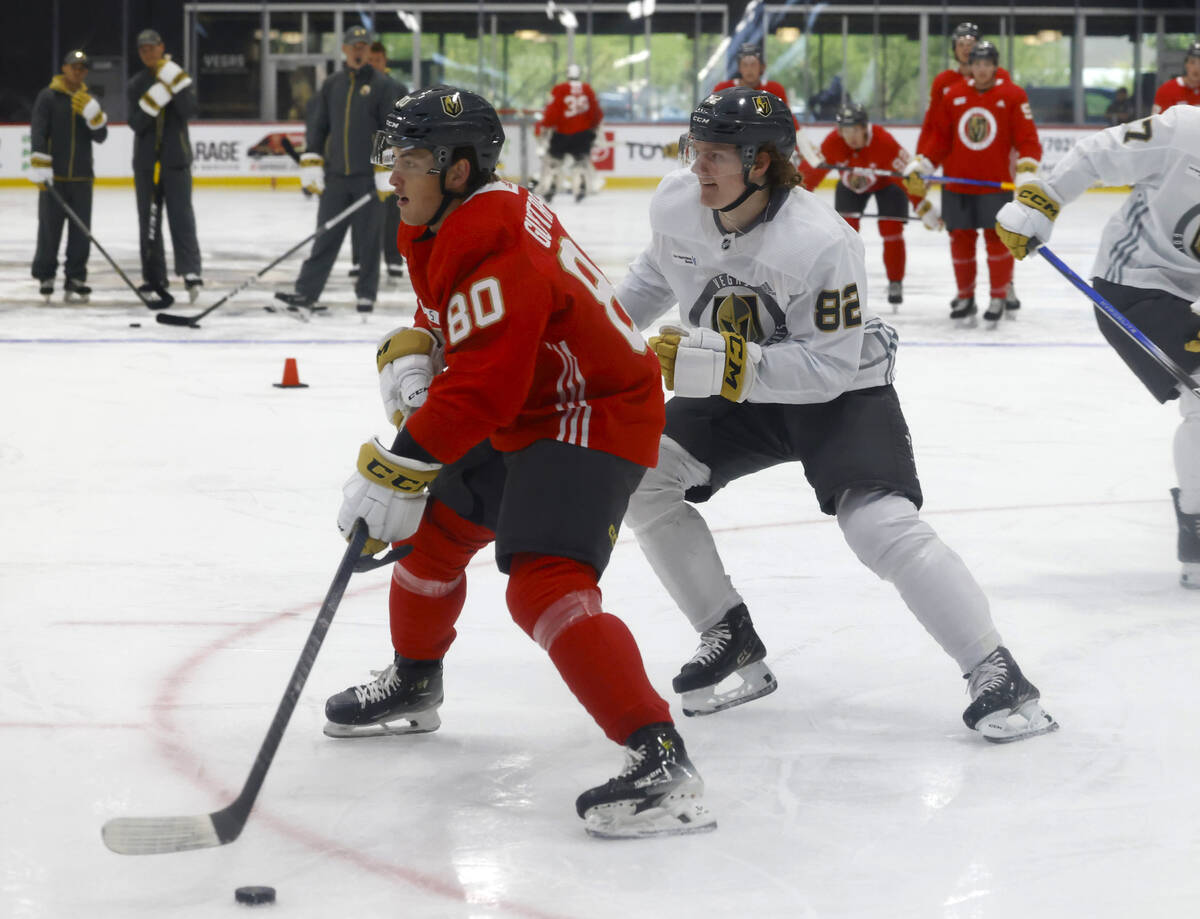 Golden Knights defensemen Lukas Gustafsson (80) and Abram Wiebe (82) skates during team's devel ...