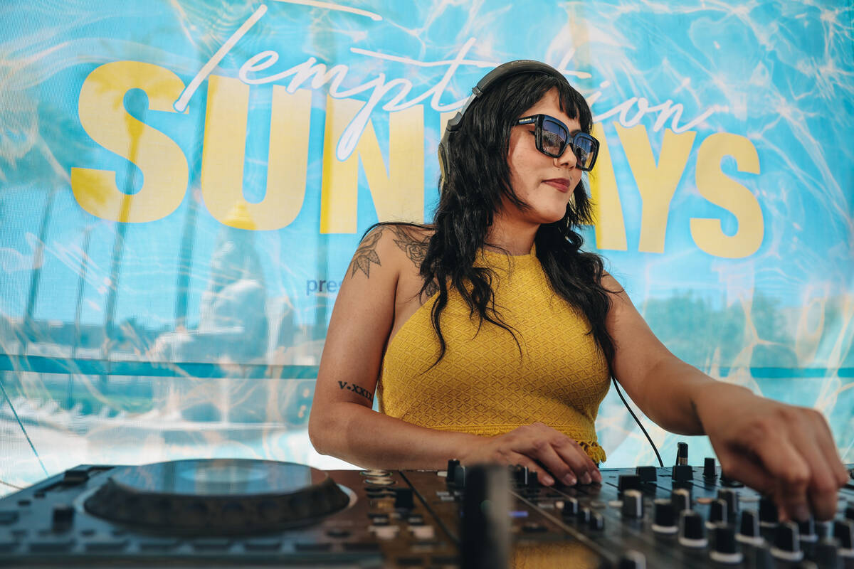 DJ Aravi DJs during Temptation Sundays, an LGBTQ+ pool party at the Luxor pool on Sunday, June ...