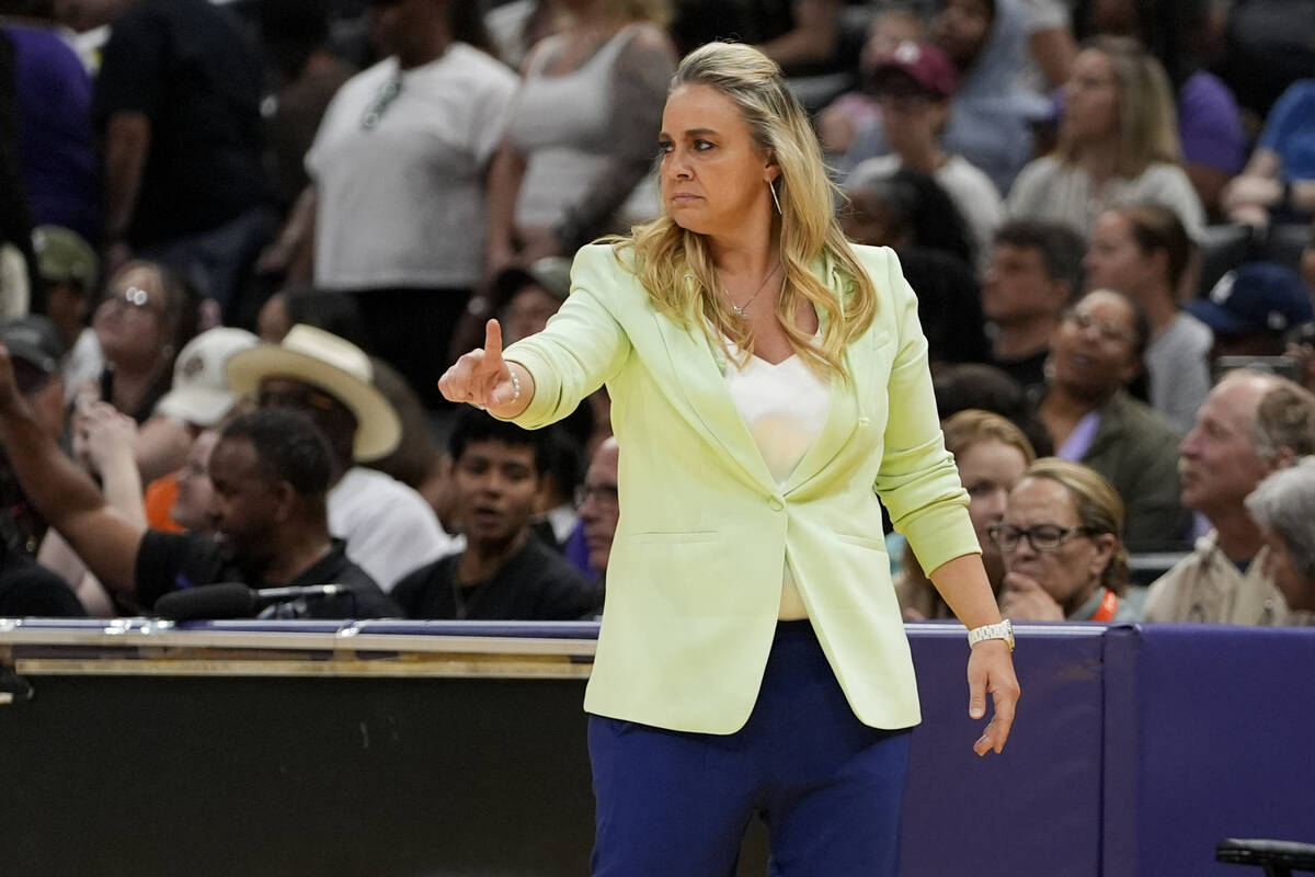 Las Vegas Aces head coach Becky Hammon gestures during the first half of a WNBA basketball game ...