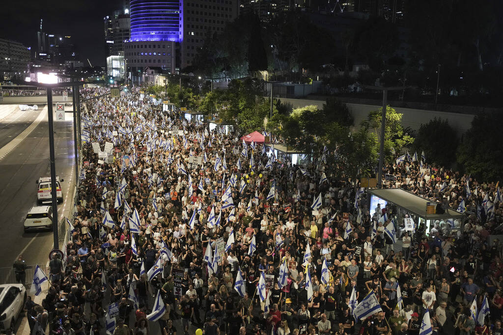 People protest against Israeli Prime Minister Benjamin Netanyahu's government and call for the ...