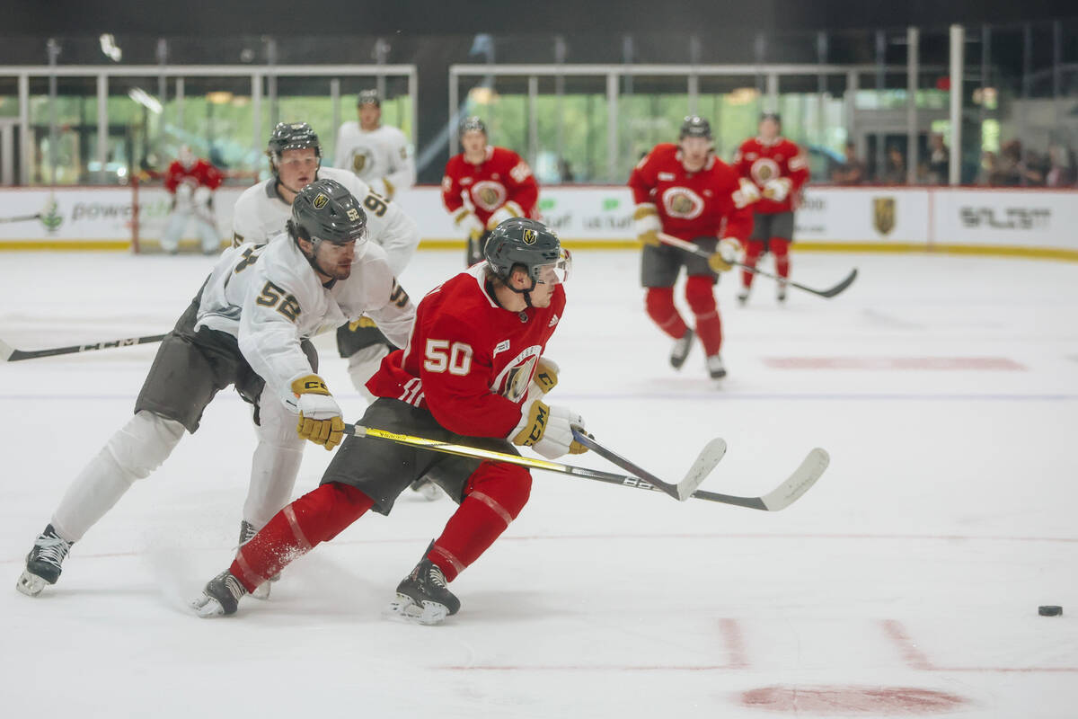 Golden Knights development camp players Garrett Schifsky (50) and Tyler Kopff (56) skate after ...