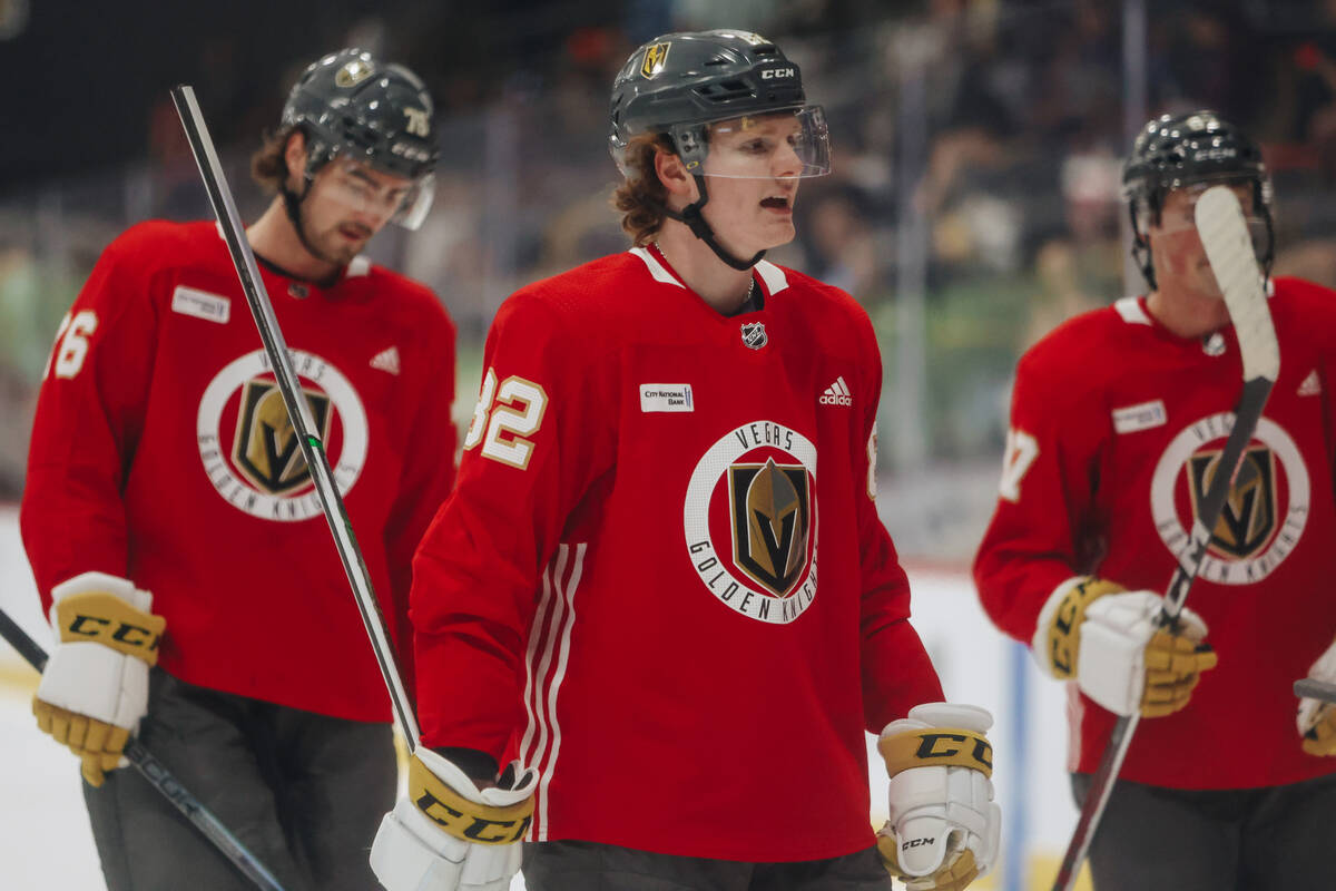 Abram Wiebe (82), a defenseman, skates off the ice with his teammates during a scrimmage on the ...