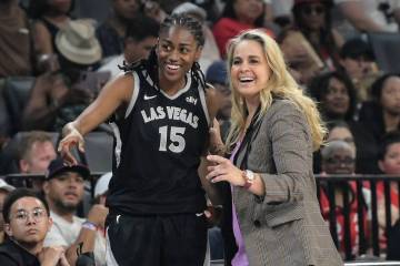 Las Vegas Aces guard Tiffany Hayes (15) and head coach Becky Hammon during the first half of th ...
