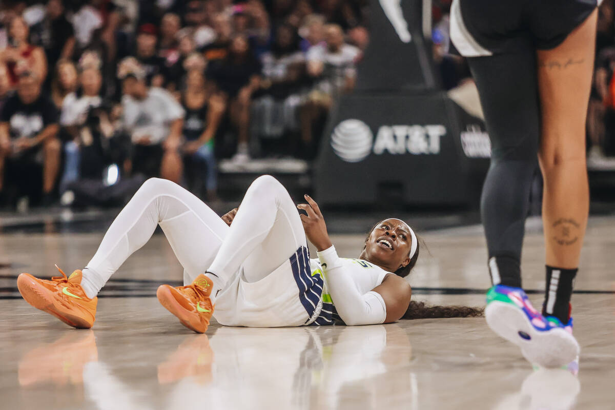 Dallas Wings guard Arike Ogunbowale (24) looks to a referee after falling during a WNBA basketb ...