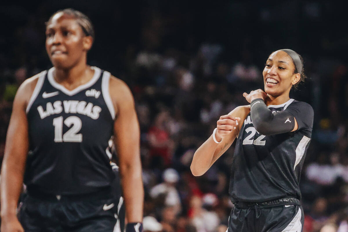 Aces center A'ja Wilson (22) walks back not the court after being announces as the aces’ ...