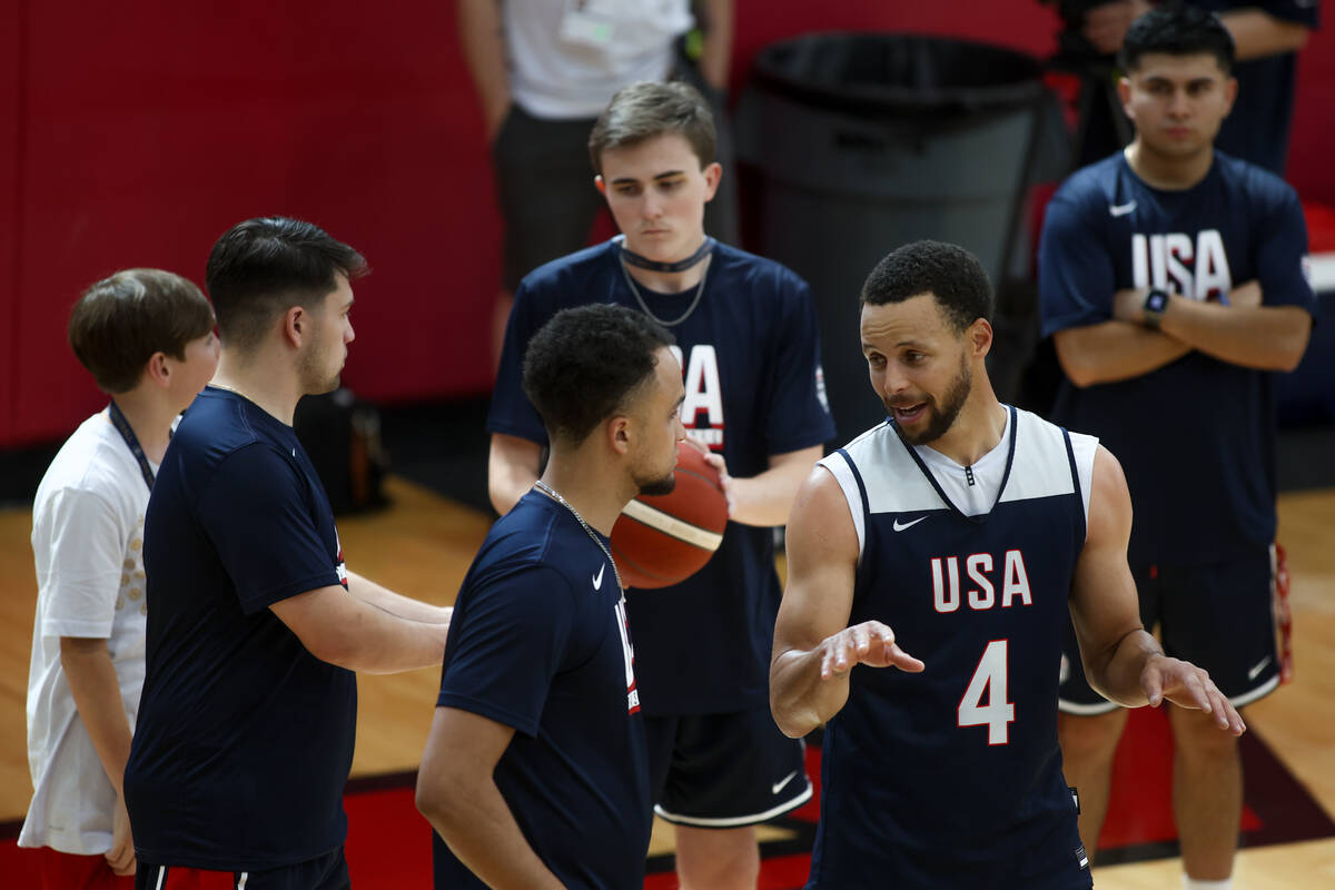 Golden State Warriors guard Stephen Curry (4) speaks with staff during training camp for the US ...