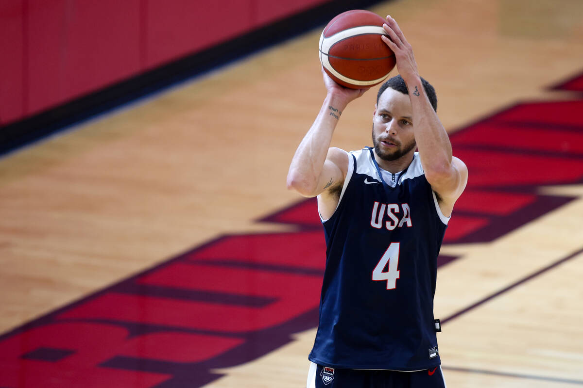 Golden State Warriors guard Stephen Curry shoots during training camp for the USA Basketball Me ...