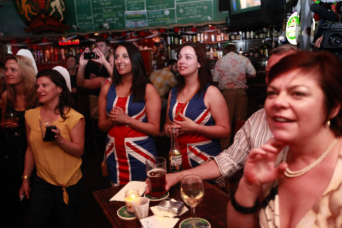 Aisha Arif, center left, and Laura Attwood, both of the United Kingdom, watch Kate Middleton ar ...