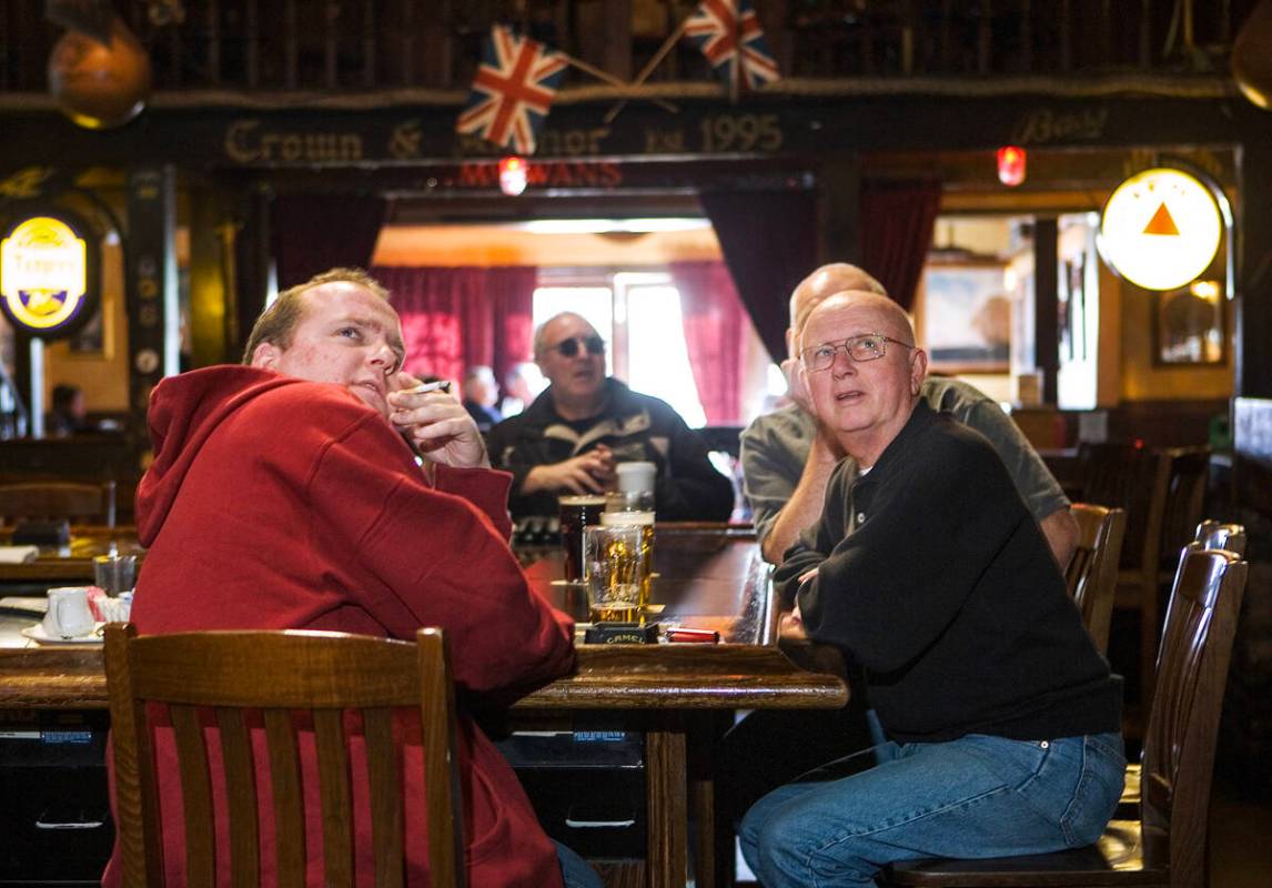 Allan Marks, 33, of England, left, "Scotty" Cameron, right, and Paul Marks, behind Ca ...