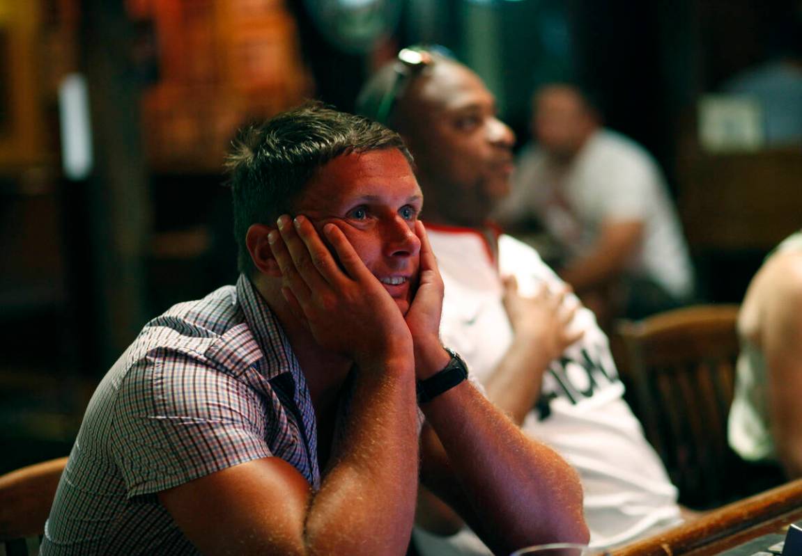 Wes Davis watches Manchester United play Swansea City on television at the Crown & Anchor p ...