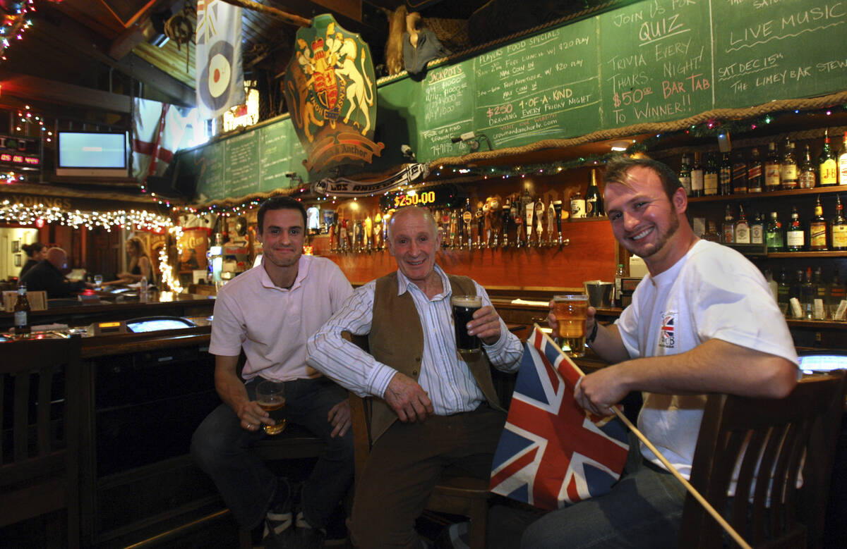 Fans of British boxer Ricky Hatton, George Beard, center, is flanked by his sons Luke, left, an ...