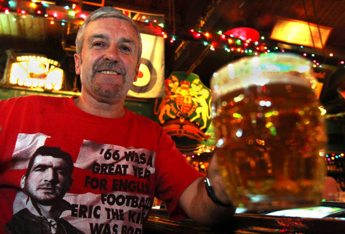 Fan of British boxer Ricky Hatton, Jimmy Grundy from Manchester, England, hoists a beer at the ...