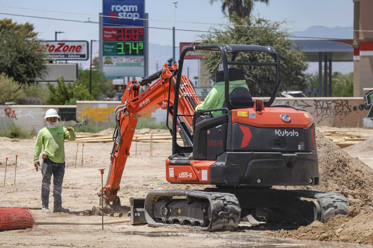 Laborers work at a construction site in East Las Vegas, Monday, July 8, 2024. An excessive heat ...