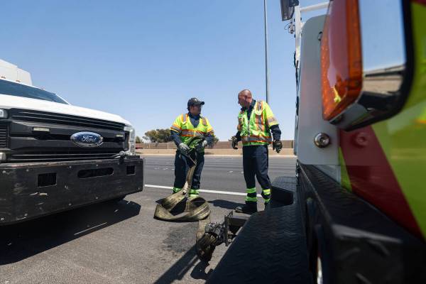 Stephen SanFilippo, supervisor for the Freeway Service Patrol, right, helps out his patrol ...