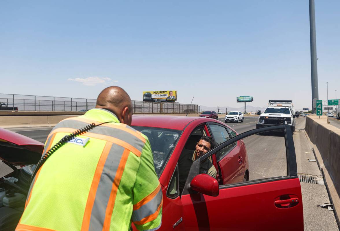 Stephen SanFilippo, supervisor for the Freeway Service Patrol, assists motorist Pablo Salcido ...