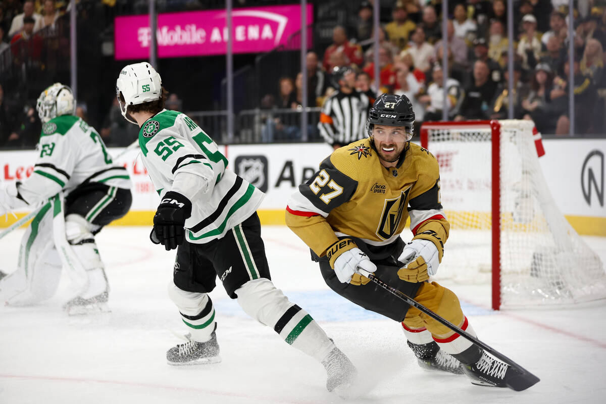 Golden Knights defenseman Shea Theodore (27) reacts after Stars goaltender Jake Oettinger (29) ...