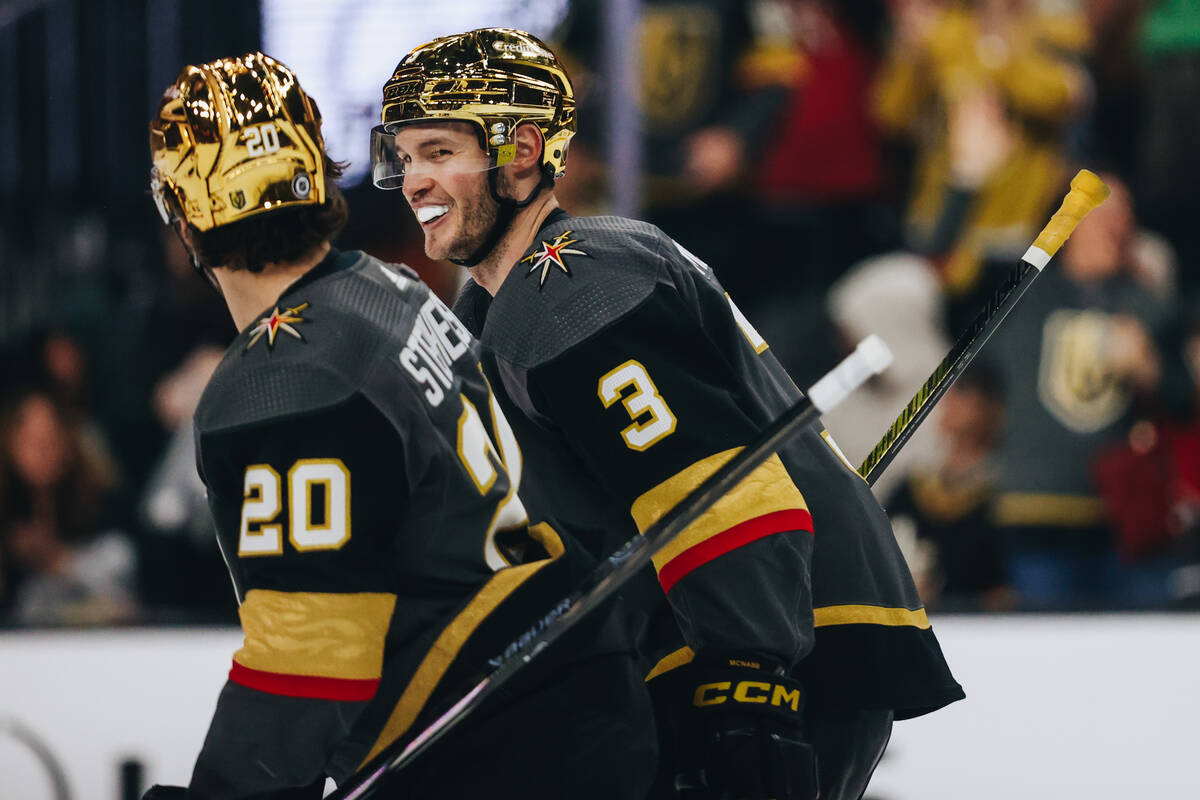 Golden Knights defenseman Brayden McNabb (3) celebrates a goal by teammate Golden Knights cente ...