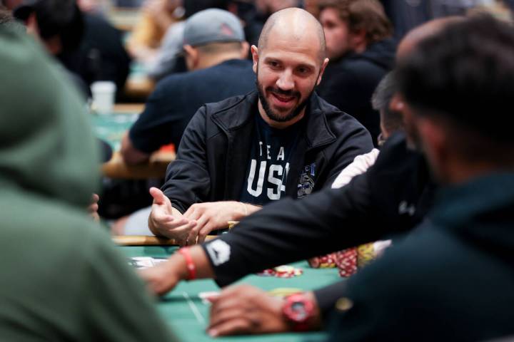 Mo Nuwwarah chats at the table during the World Series of Poker main event at Paris Las Vegas o ...